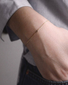 Women Unite drop armband guld