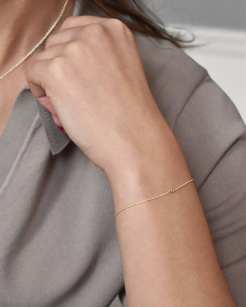 Women Unite drop armband guld